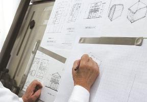 An architect draws a blueprint