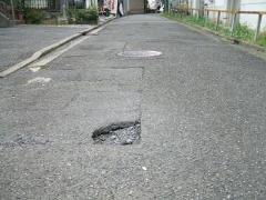 Photo of a hole in the pavement